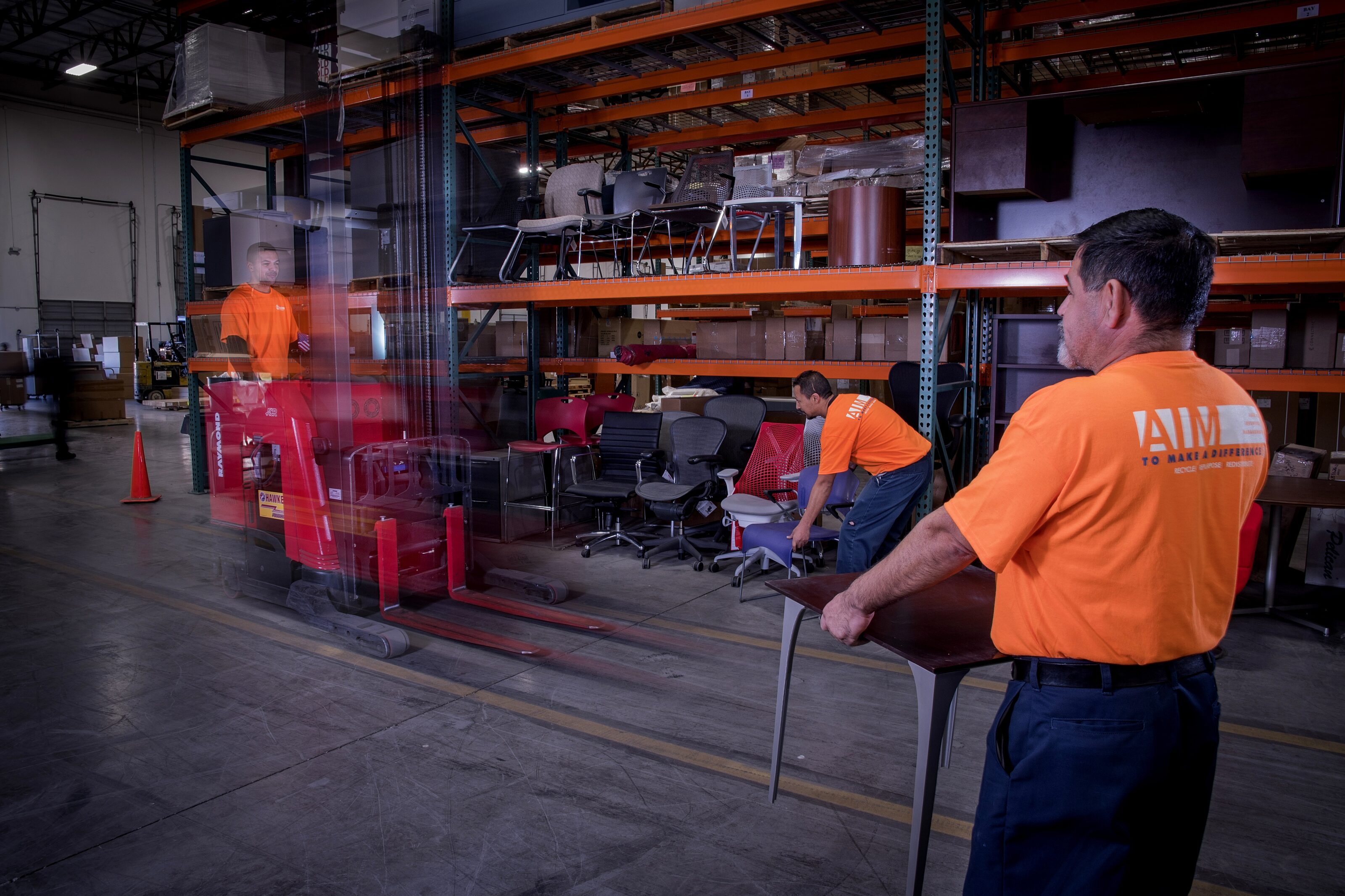 Warehouse workers moving furniture